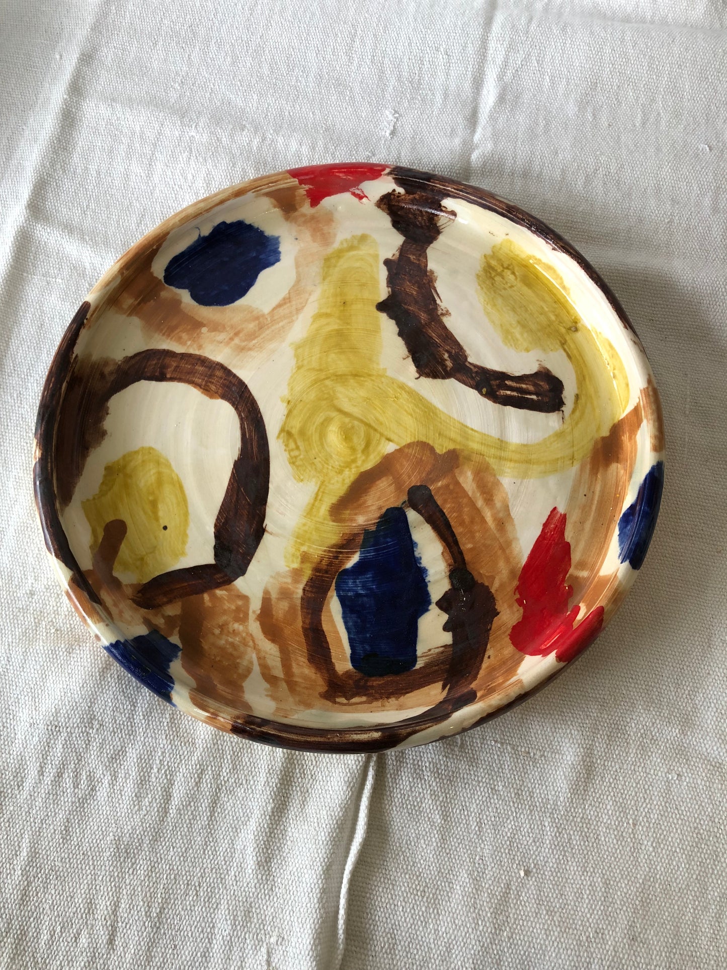 Abstract Plate in Browns, Blue and Red