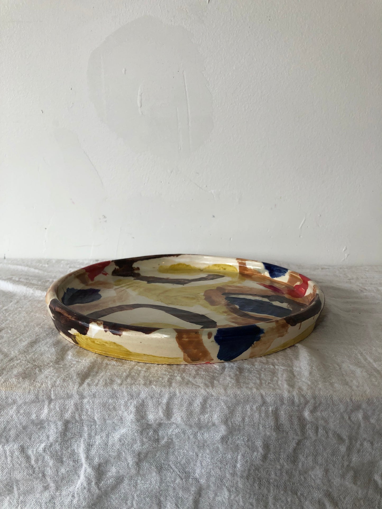 Abstract Plate in Browns, Blue and Red
